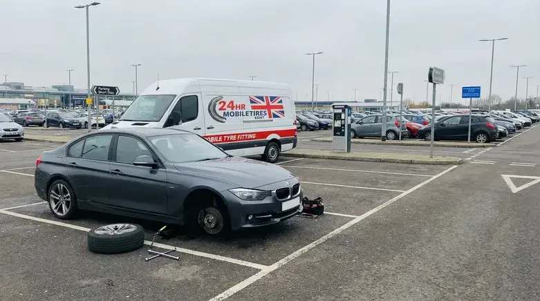 Mobile tyre fitting Dover service replacing flat car tyre in shopping centre car park with 24hr mobile tyre fitting van