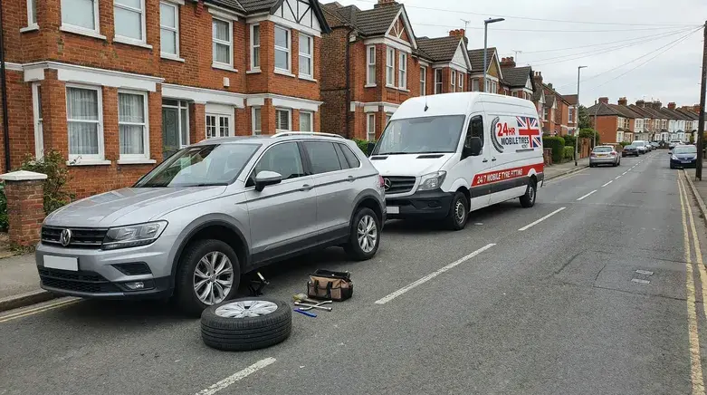 Mobile Tyre Repair 35 24hr mobile tyre replacement service in Kent repairing car tyre on residential road